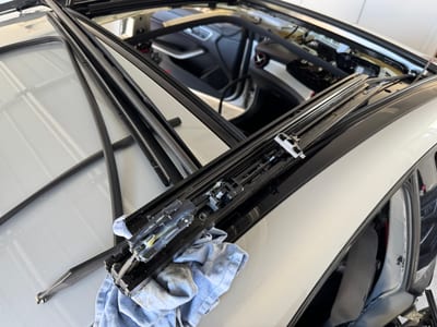 Mercedes panoramic sunroof opened during a drainage and motor inspection.